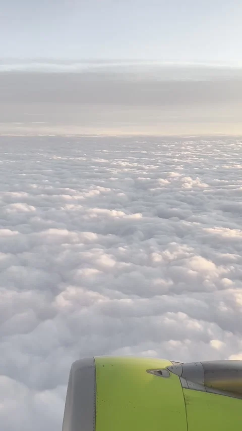 View of the clouds and aircraft engine from the inside. Vertical Stock Footage 170075286