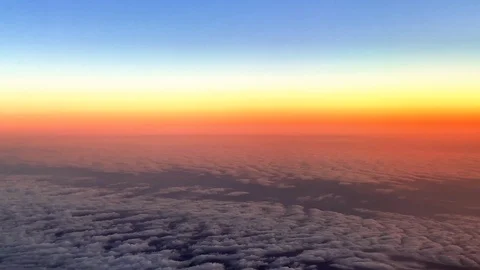 View of clouds and mountains from a flying plane Stock Footage 114543695