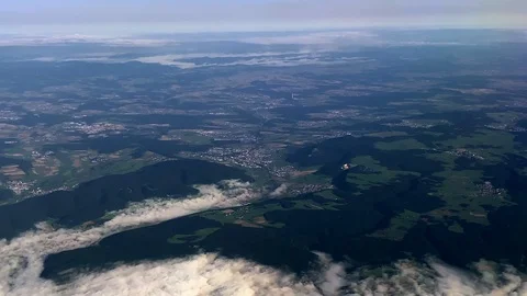 View of clouds and mountains from a flying plane Stock Footage 116417078