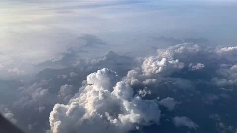View Of Clouds And Mountains From The Plane Stock Footage 251383996