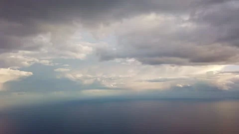 View of clouds and sea from above from the plane. Stock Footage 133792095
