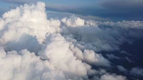 View of clouds and the solar sky from above from the plane. Clouds in the window Stock Footage 133790513