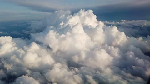 View of clouds and the solar sky from above from the plane. Clouds in the window Stock Footage 133805139