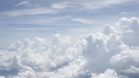 View of clouds in the blue sky from plane porthole Stock Footage 318525162