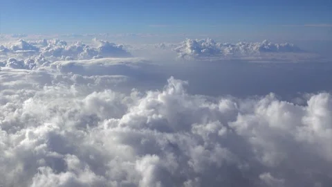View of clouds in the blue sky from plane Stock-Footage 329694165