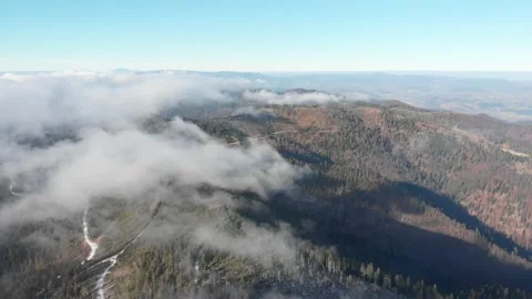 View of clouds flowing over mountain top. Vertical takeoff over Radziejowa. Stock Footage 143990016
