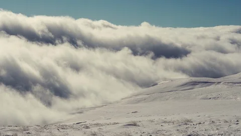 View of clouds from a high mountain. Cloudy sky on a highland. Winter landscape  Stock-Footage 124019049
