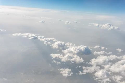 View of Clouds from Jet Window at 10 Kilometers Altitude Stock Photos