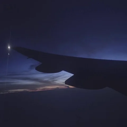 View of clouds, lightening rain from aircraft window in a bumpy ride. Video stock 69359737