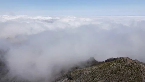 View of the clouds next to the mountain peak Stock Footage 232543939