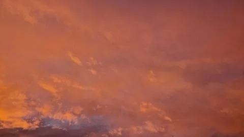 View of clouds in a orange red sunset 库存照片