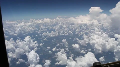 View of Clouds Over Land From A Plane Window.mp4 Video stock 65530578