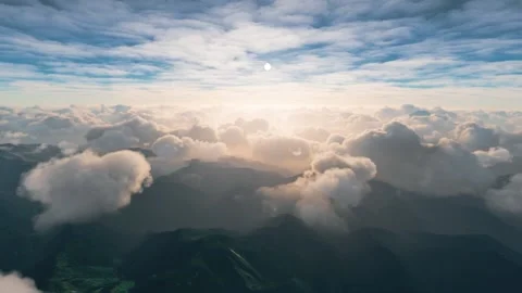 View of clouds over the mountains from a cockpit of a plane Stock Footage 160152502