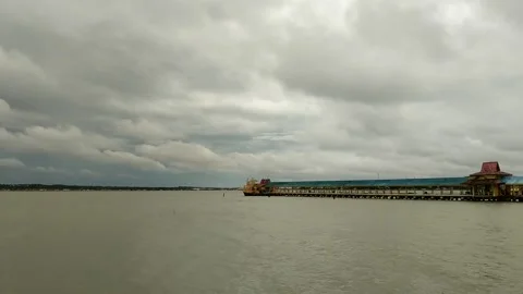 View of the clouds over the sea pier Stock Footage 220595341