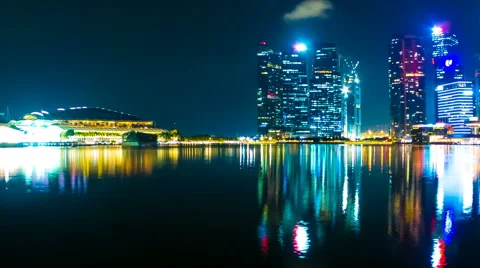 View as clouds pass by over the skyline of Singapore at night Stock Footage 64580013
