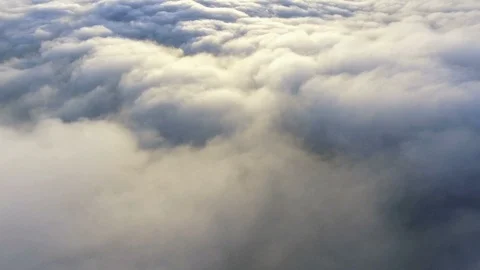 View of the clouds from the plane. flying over earth Stock Footage 104416834