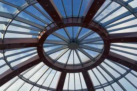 View of the clouds in the sky through the glass roof. Stock Photos