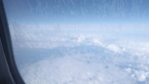 View of clouds through windows of a plane. Window plane Vídeos de archivo 128926510