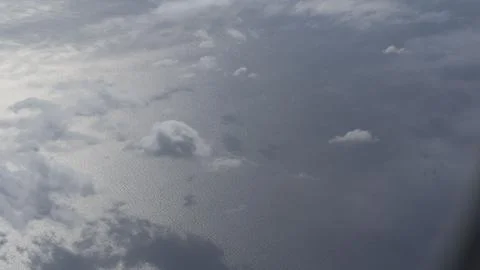 View of the clouds from the window of an airplane Stock Photos