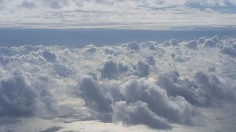 View of the clouds from the window of an airplane Stock Photos