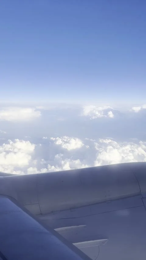 View of clouds from the window of a flying airplane Stock Footage 310047277