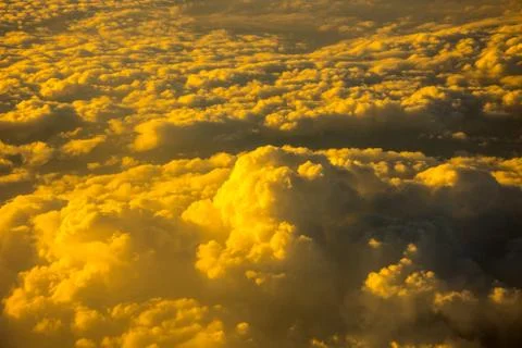 The view to the clouds from the window of the plane Stock Photos