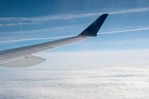 View of the clouds from within, out of the plane Stock Photos