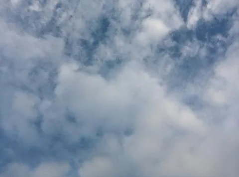 A view of the cloudy blue sky on a cool day Stock Photos