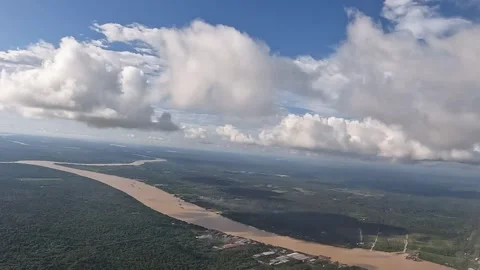 View of Cloudy day and river from Airplane Window. Stock Footage 256618295