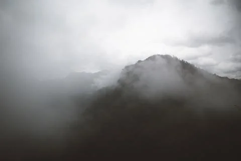 View of a cloudy mountain range Stock Photos