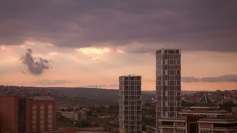 View of the cloudy sky over sity in sunset, time-lapse Stock Footage 76170523
