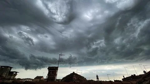 View of the cloudy sky before the storm, from the rooftops of Venice Stock Photos
