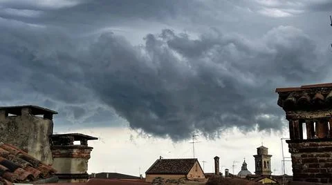 View of the cloudy sky before the storm, from the rooftops of Venice Stock Photos