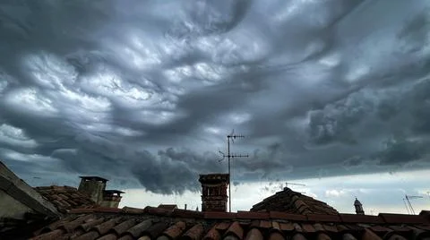 View of the cloudy sky before the storm, from the rooftops of Venice Stock Photos