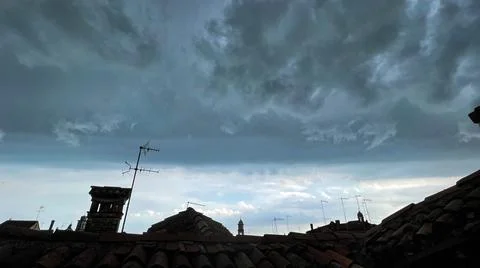 View of the cloudy sky before the storm, from the rooftops of Venice Stock Photos