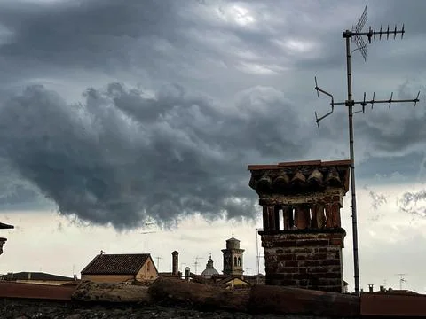 View of the cloudy sky before the storm, from the rooftops of Venice Stock Photos