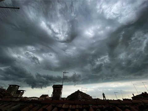View of the cloudy sky before the storm, from the rooftops of Venice Stock Photos