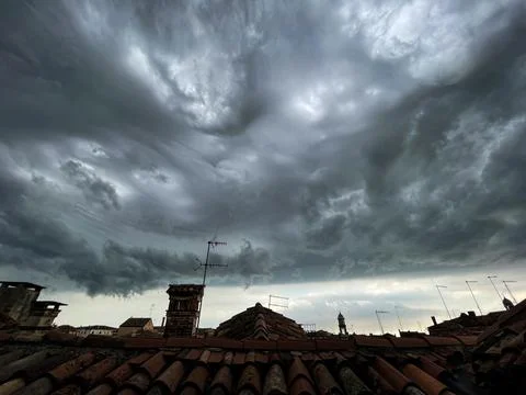 View of the cloudy sky before the storm, from the rooftops of Venice Stock Photos