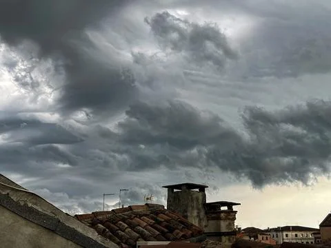 View of the cloudy sky before the storm, from the rooftops of Venice Stock Photos