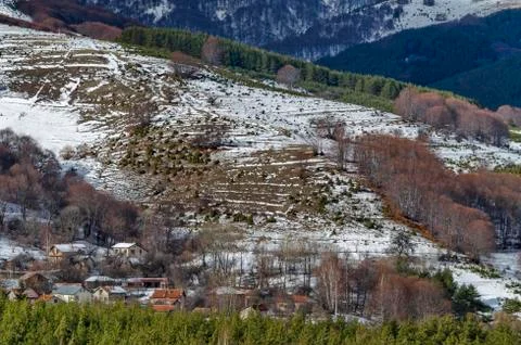 View of cloudy sky, winter mountain, residential district  and forest Stock Photos