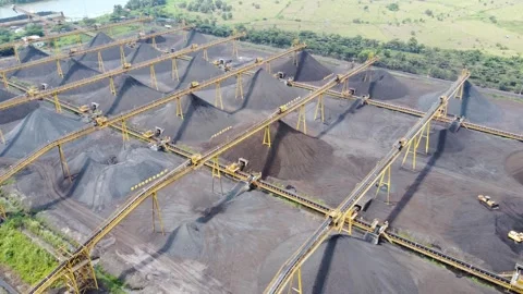 View of the coal terminal air with coal transport trucks and coal conveyor .. Stock Footage 293115654
