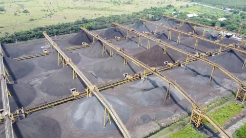 View of the coal terminal air with coal transport trucks and coal conveyor .. Stock Footage 293115926