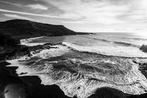 View of the coast and the Atlantic Ocean. El Golfo viewpoint. Black and white Фото
