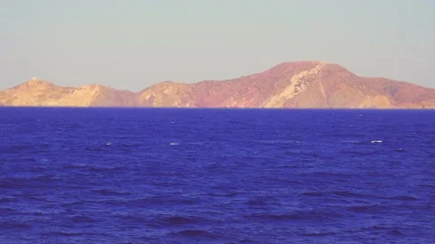 View of the coast from a cruise ship. The immensity of the blue sea shaken by Vídeo Stock 167796880