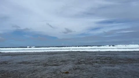 View from the coast to the raging ocean waves in the distance Video stock 312378725