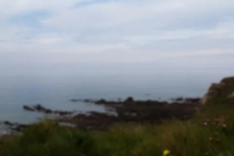 View from the coastal path between Widemouth Bay and Bude Out of focus. Stock Photos