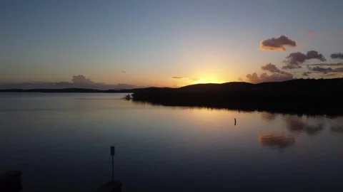 View of Coastline and Mountainous Background With The Sunset Stock Footage 273835731