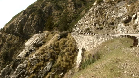 View of a Coastline at Big Sur with a car passing by Video stock 53816640