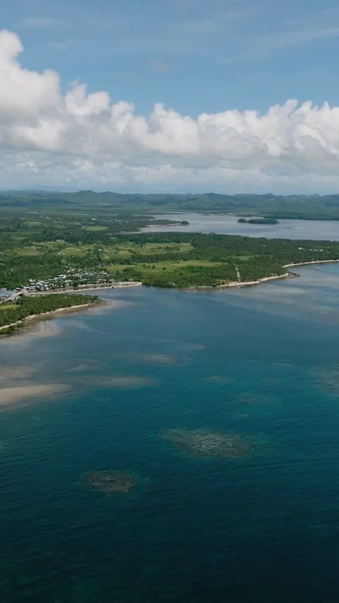View of coastline with reef and green hills. Siargao, Philippines. Stock Footage 321104447
