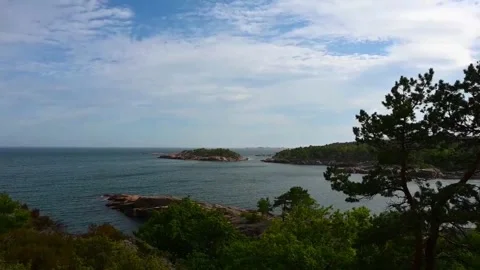 View of coastline with water and trees in Norway during daylight in summer Stock Footage 340208986